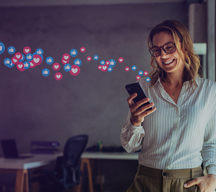 woman with emoticons coming out of phone